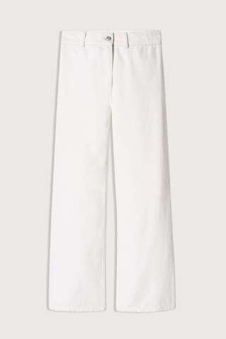 flat lay Megan Jean Cream Mid-rise
Wide leg jean
Fitted through waist and hips
Cropped ankle length
Opens to a relaxed leg
No front pockets
No outer side seam
Back patch pockets
Back darts
Zip fly
Shank closure
Belt loops