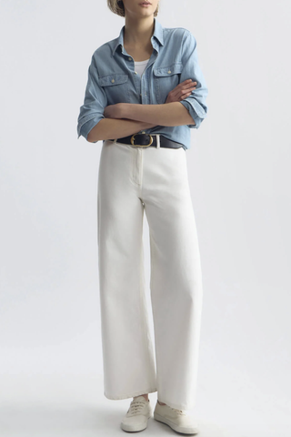 front profile model wearing Megan Jean Cream Mid-rise
Wide leg jean
Fitted through waist and hips
Cropped ankle length
Opens to a relaxed leg
No front pockets
No outer side seam
Back patch pockets
Back darts
Zip fly
Shank closure
Belt loops