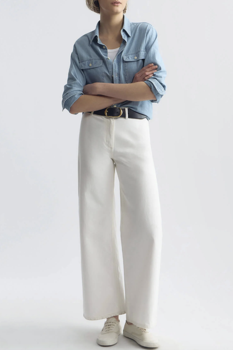 front profile model wearing Megan Jean Cream Mid-rise
Wide leg jean
Fitted through waist and hips
Cropped ankle length
Opens to a relaxed leg
No front pockets
No outer side seam
Back patch pockets
Back darts
Zip fly
Shank closure
Belt loops