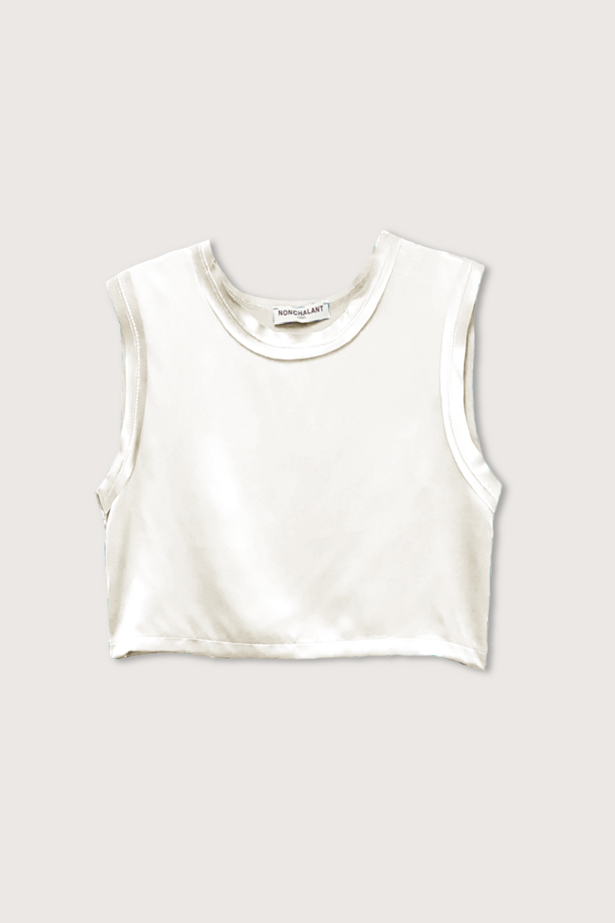 flat lay Mel Crop Cream muscle tee style