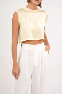 front profile model wearing Mel Crop Yellow muscle tee style 