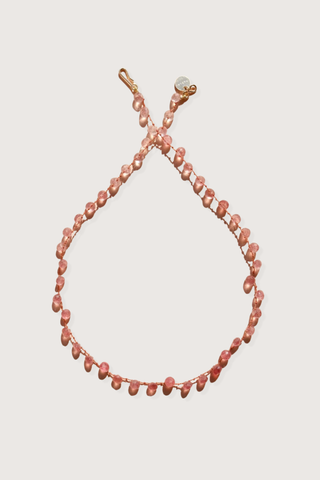 flat lay Melrose Strawberry Quartz Necklace The stones, subtly spaced by three delicate knots
Dance on a silky cord 67 carats 14K Gold-filled 'Infinity' Clasp
