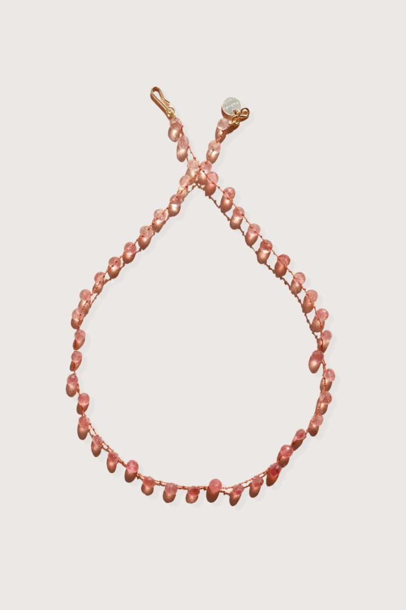 flat lay Melrose Strawberry Quartz Necklace The stones, subtly spaced by three delicate knots
Dance on a silky cord 67 carats 14K Gold-filled 'Infinity' Clasp