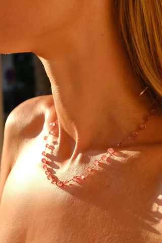 model wearing Melrose Strawberry Quartz Necklace The stones, subtly spaced by three delicate knots
Dance on a silky cord 67 carats 14K Gold-filled 'Infinity' Clasp