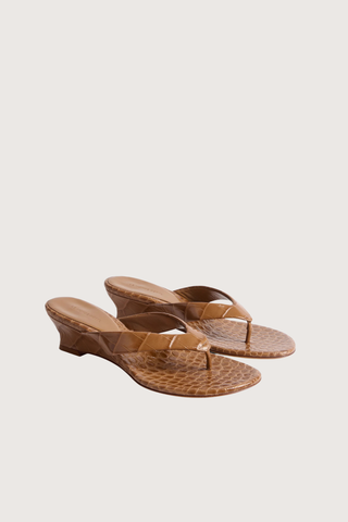 angled profile Micro Thong Wedge Brown brown croc embossed calf leather
Cushioned calf leather insole
10mm heel
Slip on