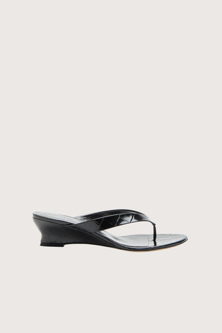 side profile Micro Thong Wedge Sandal Black Micro Wedge Thong
Coco black croc embossed leather
Cushioned calf leather insole
40mm heel