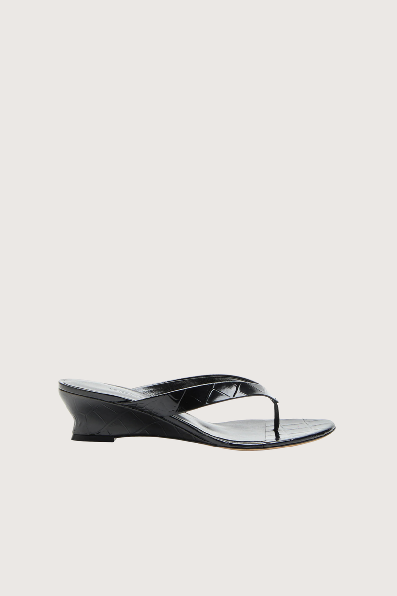 side profile Micro Thong Wedge Sandal Black Micro Wedge Thong
Coco black croc embossed leather
Cushioned calf leather insole
40mm heel