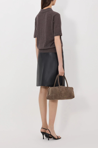 back profile model wearing Migo Cashmere Polo Brown Melange Fluid, fine knit cashmere
Straight fit
Spread collar
Small button placket
Ribbed details