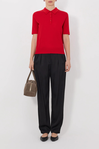 front profile model wearing Migo Cashmere Polo Red Fluid, fine knit cashmere
Straight fit
Spread collar
Small button placket
Ribbed details