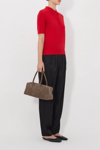 side profile model wearing Migo Cashmere Polo Red Fluid, fine knit cashmere
Straight fit
Spread collar
Small button placket
Ribbed details