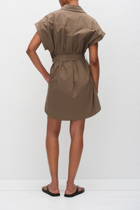 back profile model wearing Mini Shirt Poplin Dress Birch 
Removable self belt
Loops at the side waist
Concealed button placket
Bartack detailing
Inseam pockets at the hip
100% Organic Cotton Poplin