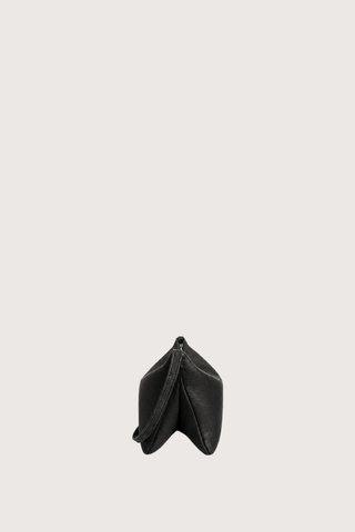 side profile without strap expanded Moore Cross Body Bag Ink black Folded leather panel construction
Top zip closure
Two separate interior compartments
Adjustable strap is fixed on the interior
100% Calfskin Leather