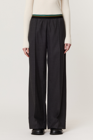 front profile model wearing Multi Color Elastic Waisted Band Trouser black melange Wool twill
Straight fit
Multicolor elastic waistband
100% Sheep Wool | LINING: 100% Cotton