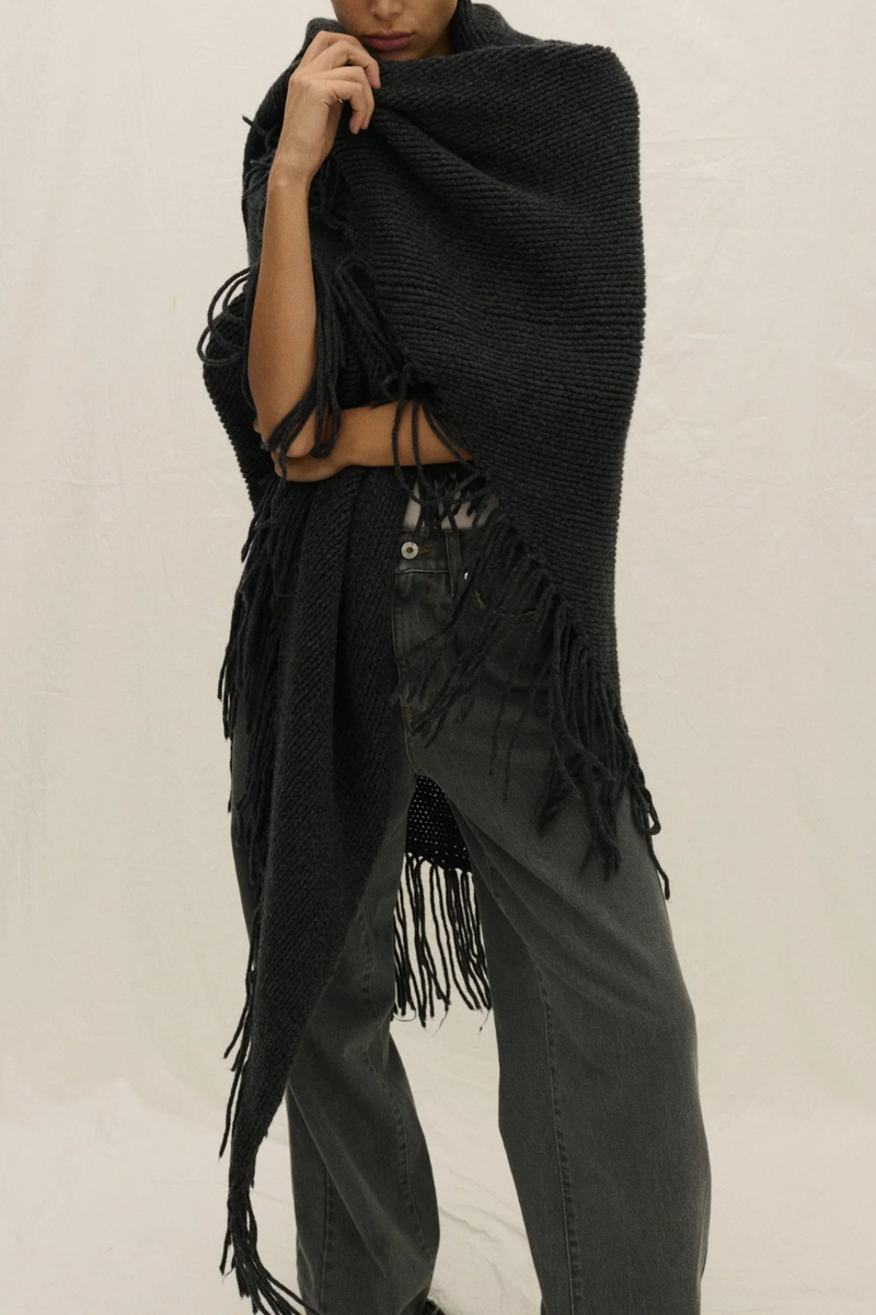 front profile model wearing Myles Shawl With Fringe charcoal grey Hand knitted
Italian cashmere blend yarn
Oversized
Long hand knotted fringe
Designed to be wrapped
Italian Yarn