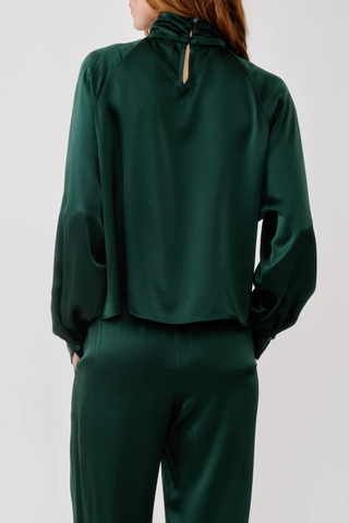 back profile model wearing Nadine Silk Blouse Hunter green Gathered turtleneck
Relaxed silhouette
100% Silk