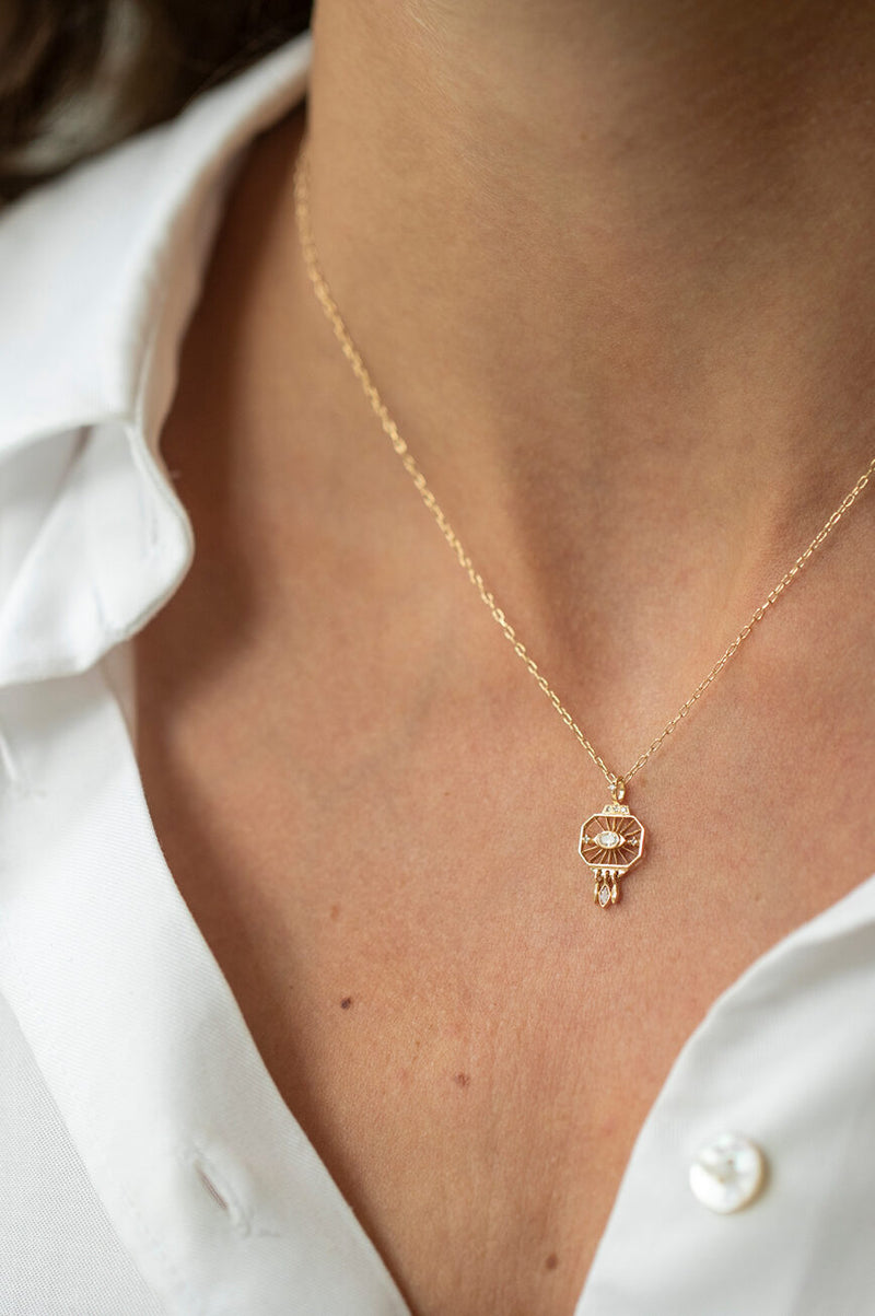 model wearing Neck Open Plate Oval Diamond Fringe dangle detail necklace 14k gold with diamonds