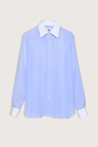flat lay New Work Shirt light blue and white Fluid silk body
Crisp white cotton poplin square collar and cuffs
Hem gussets in white poplin finish
Straight cut - classic fit
Back yoke with pleat
Mother-of-pearl buttons
Light weight fabric
90% silk crepe de chine/10% cotton poplin