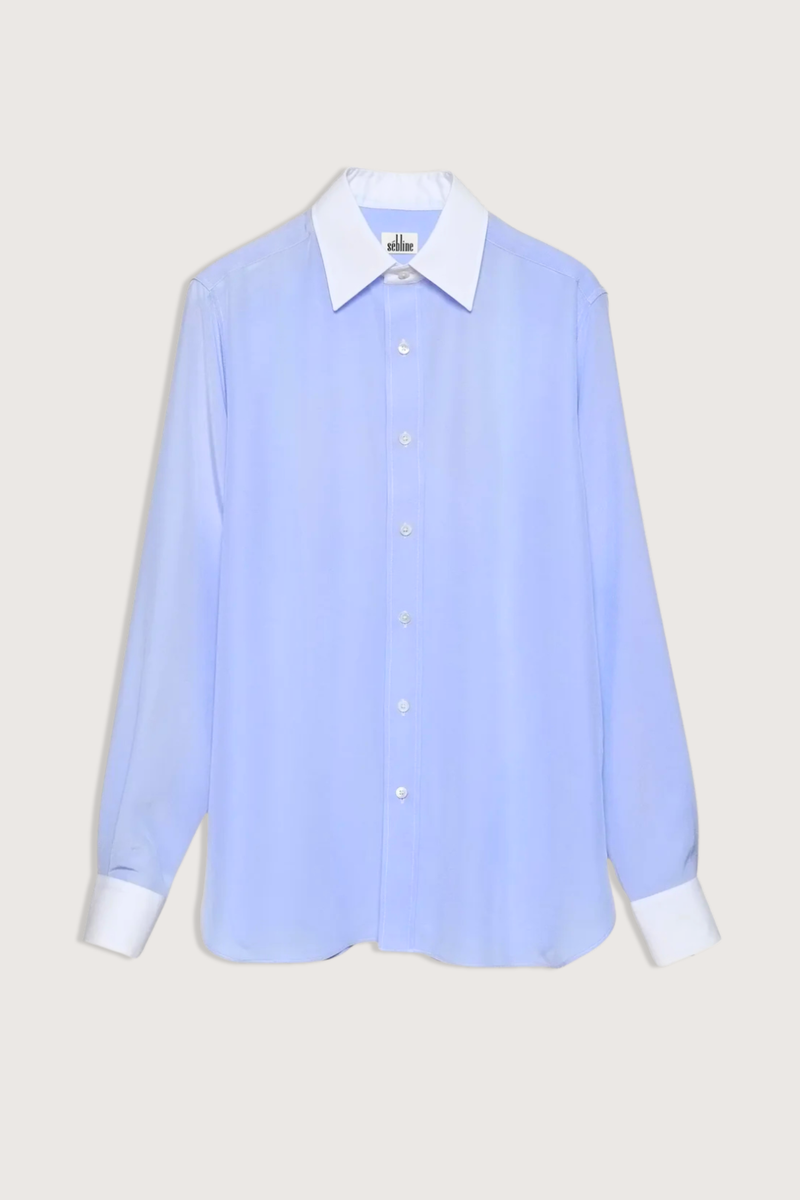 flat lay New Work Shirt light blue and white Fluid silk body
Crisp white cotton poplin square collar and cuffs
Hem gussets in white poplin finish
Straight cut - classic fit
Back yoke with pleat
Mother-of-pearl buttons
Light weight fabric
90% silk crepe de chine/10% cotton poplin