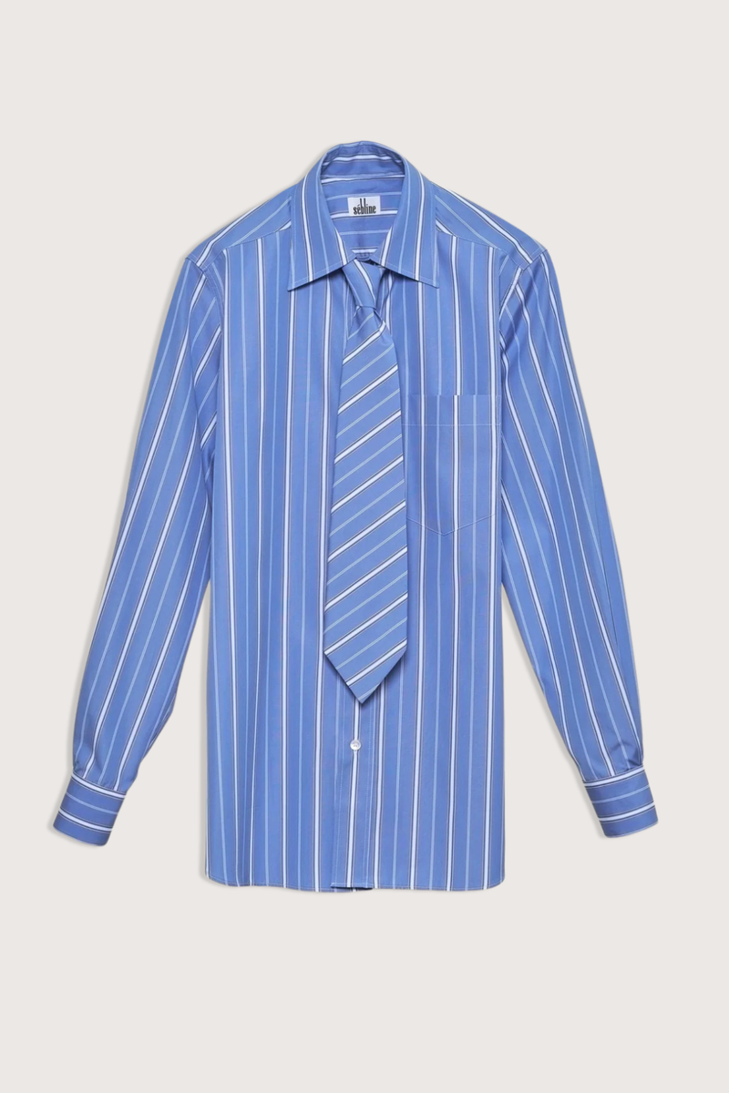 flat lay New Work Shirt With Tie blue white stripe Mid blue Regency stripe
Square collar
Button placket
White hem gussets finish the side seams
Curved hem
Straight cut - classic fit
Back yoke with pleat
Square cuff
Mother-of-pearl buttons
Medium weight fabric
100% two-ply cotton poplin 