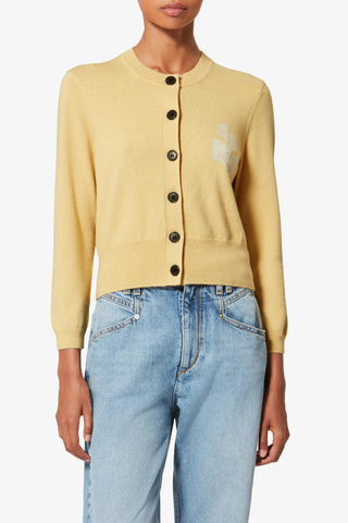 front profile model wearing  Newton Iconic Cardigan Light Yellow Cotton cardigan with long sleeves
Round neck
Button closure
Marant logo
70% Cotton, 30% Laine Wool
