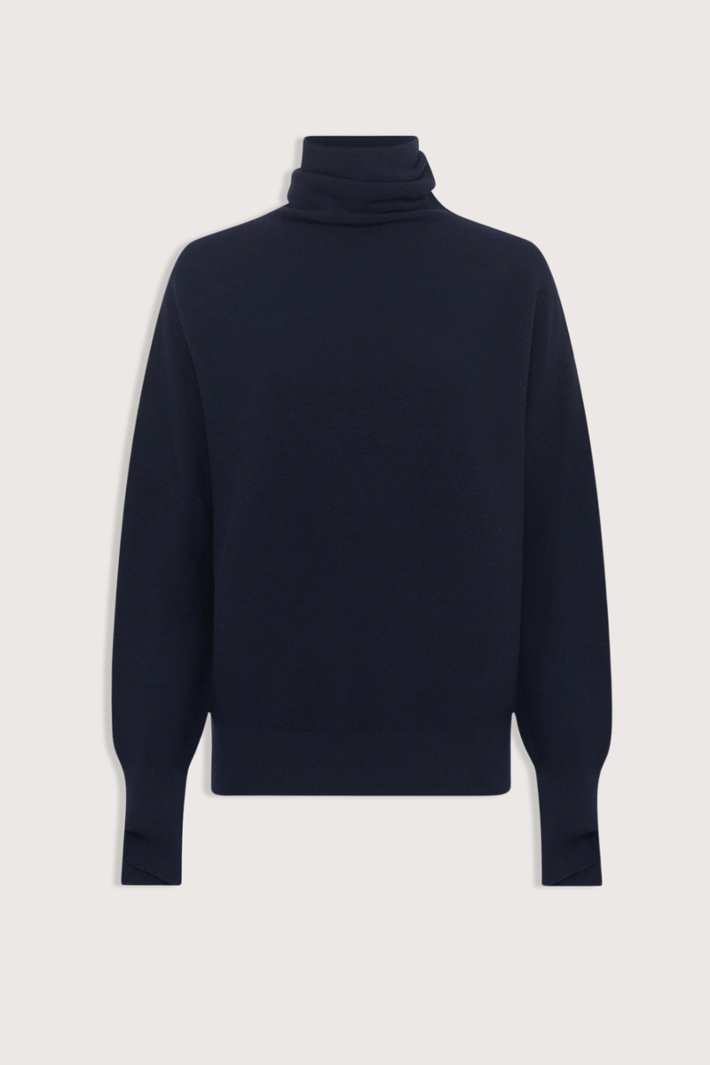 flat lay Nora Oversized High Neck Knit Top Night blue High neckline
Drapes loosely around the neck
Loose fit
Long sleeves
Garter-stitch knit sweater
Wide slit cuffs
Seamless
100% pure extra-soft virgin wool