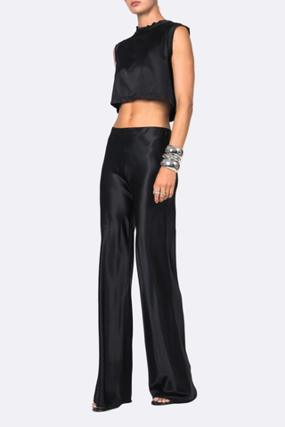side profile model wearing Norma Satin Pant black Mid rise
Straight-leg
Seamless
Drapes beautifully
Elastic waist
77% Acetate, 23% Polyester