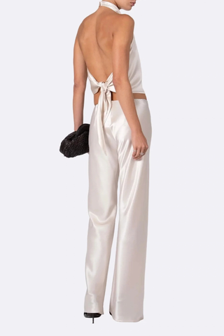 back profile model wearing Norma Satin Pant Champaign Mid rise
Straight-leg
Seamless
Drapes beautifully
Elastic waist
77% Acetate, 23% Polyester
