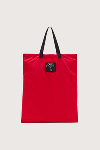 flat lay front profile Nylon Bag red with black strap and logo patch Foldable nylon tote