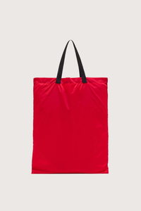 back flat lay profile Nylon Bag red with black strap and logo patch Foldable nylon tote
Leather triangle pouch included
99% nylon 99% domesticated bovine leather 1% metal 1% meta