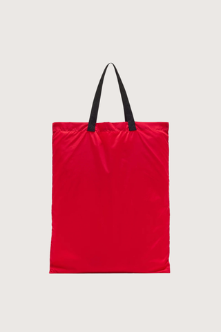 back flat lay profile Nylon Bag red with black strap and logo patch Foldable nylon tote
Leather triangle pouch included
99% nylon 99% domesticated bovine leather 1% metal 1% meta