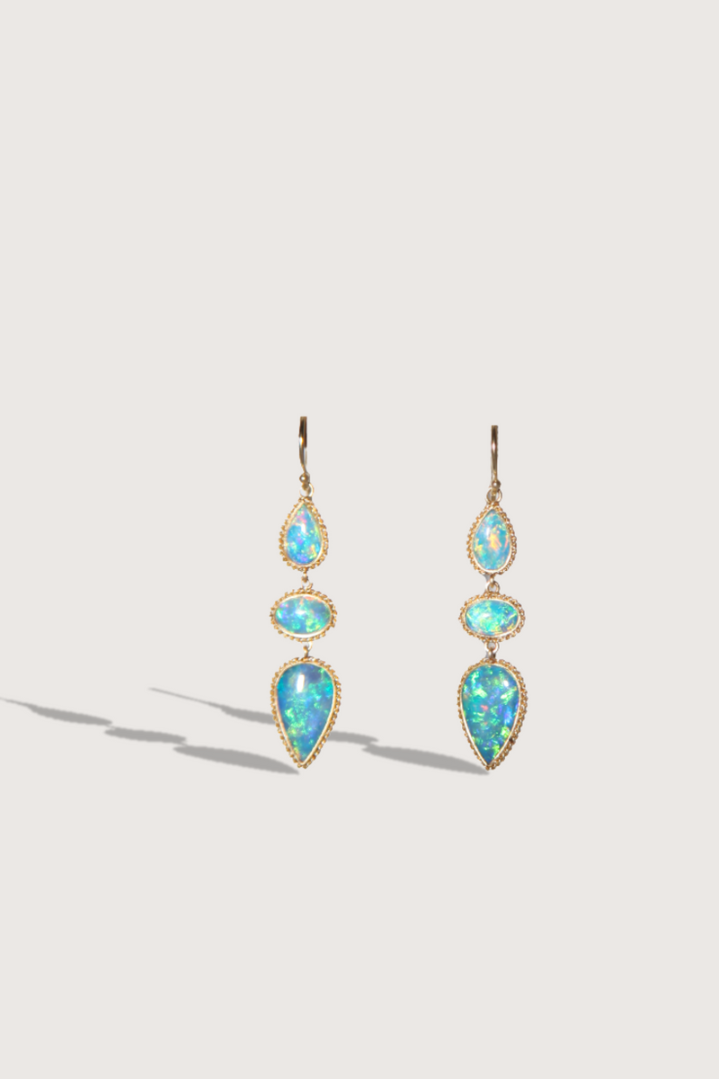 flat lay One Of A Kind Crystal Opal Earrings 18k gold