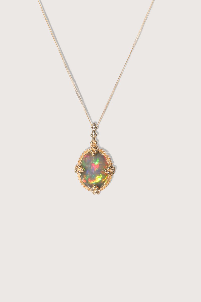 flat lay One Of A Kind Ethiopian Opal Necklace 18k gold