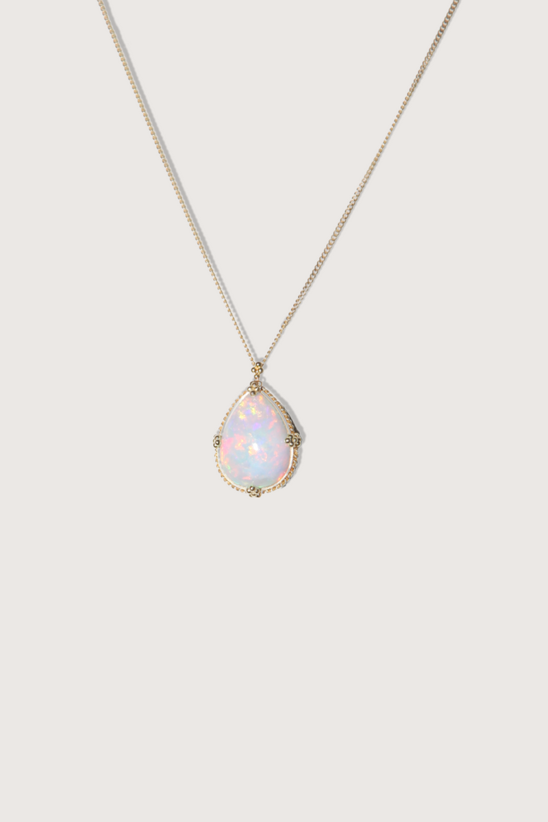 flat lay One Of A Kind Ethiopian Opal Necklace 18k gold