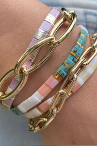 model wearing Open Link Bracelet 14k gold