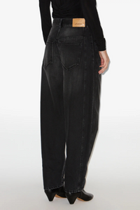 back profile model wearing Oriane Wide Denim Pant faded black barrel fit