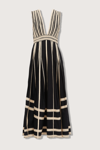 flat lay Palermo Deep V Midi Dress Ric-rac and grosgrain ribbons
Black silhouette
Plunging neckline
Full, gathered hem
Water-washed cotton poplin
Midi length
Sleeveless