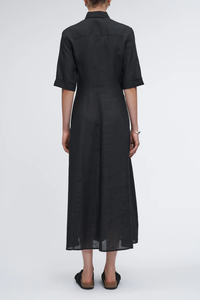 back profile model wearing Panel Shirt Dress in Black linen