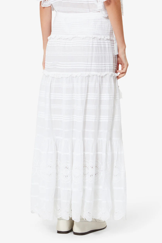 back profile model wearing Paoline Skirt white Long lace and organic cotton skirt
Elastic waist
Button tab
Pintucks and broderie anglaise
Flared cut
100% cotton