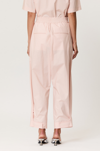 back profile model wearing Parachute Trouser With Side Detail baby pink cotton Light pink technical trousers
Smocked elastic waistband
Relaxed, tapered silhouette
