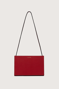 back profile Parker Brandon Horizon leather bag Short Strap red Strap length is adjustable
Outside pocket in signature frame construction with single latch closure. gold logo embossed in back