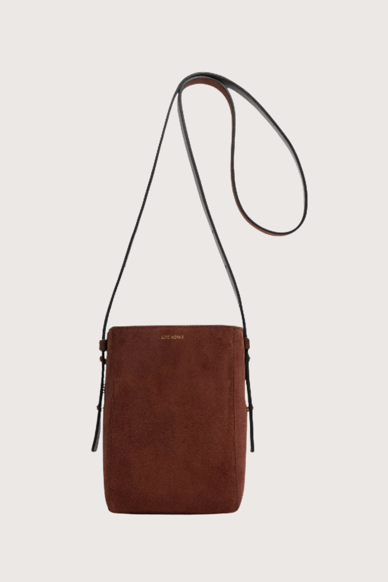 opposite side flat lay of  Parker M Long Strap Bag Marron Suede calfskin
Exterior pocket
Rectangle shape
Adjustable straps
100% Suede
Magnetic closure
