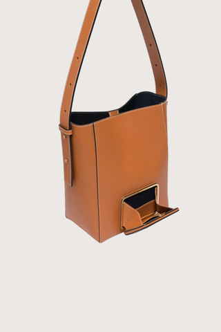 exterior pocket inside detail Parker M Soft Long Strap leather Tan bag with adjustable strap and exterior pocket