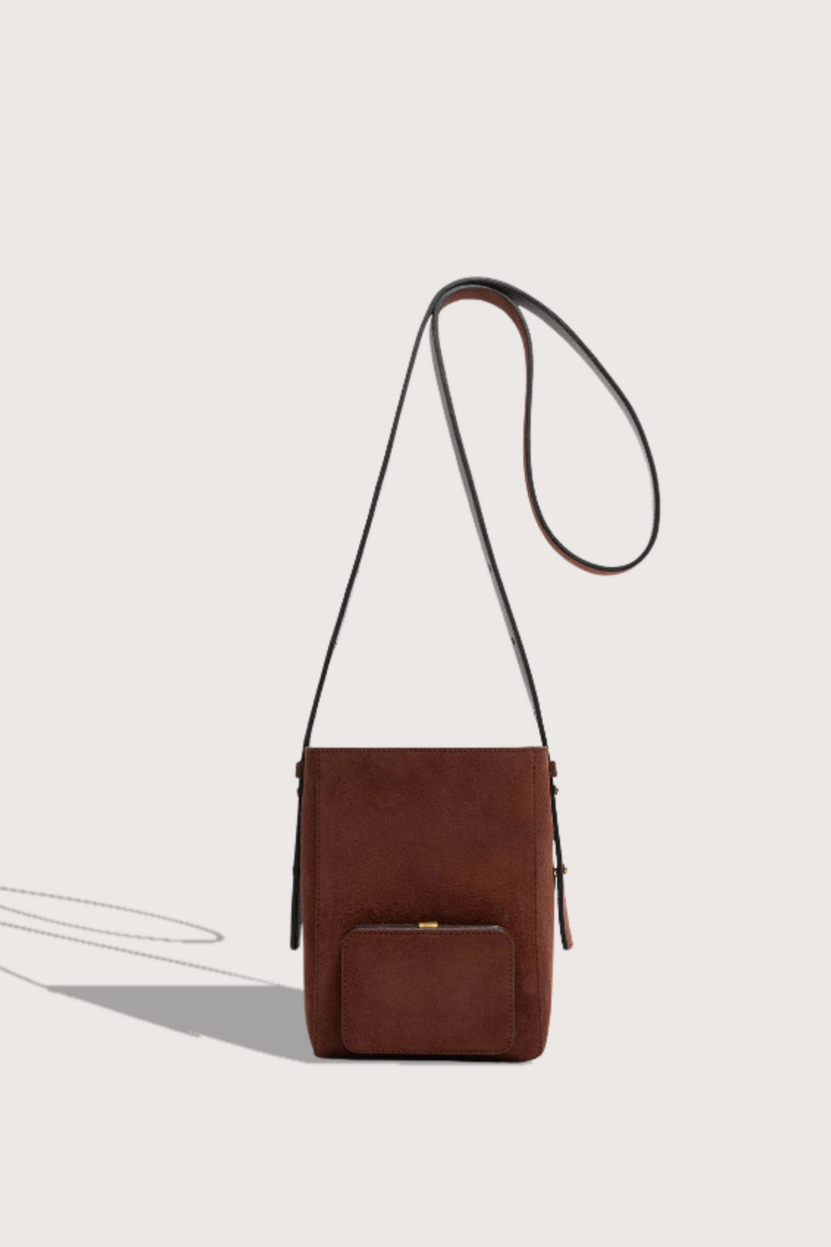 flat lay  Parker S Cross Body Bag Marron Suede calfskin
Exterior pocket
Rectangle shape
Adjustable straps
100% Suede
Magnetic closure