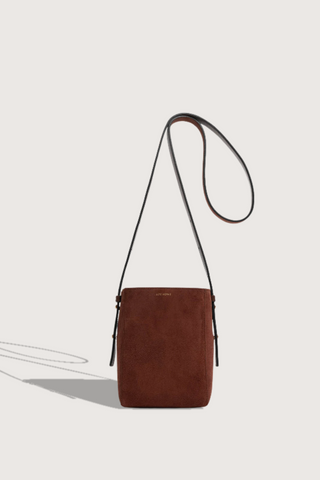 opposite side flay lay  Parker S Cross Body Bag Marron Suede calfskin
Exterior pocket
Rectangle shape
Adjustable straps
100% Suede
Magnetic closure