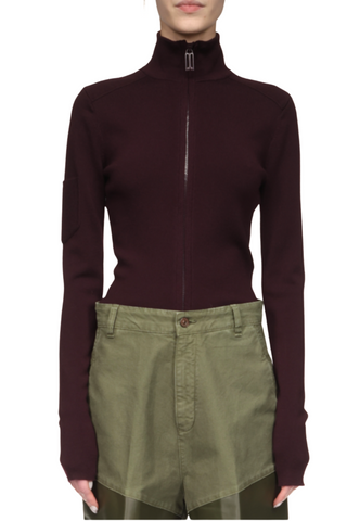 front profile model wearing Patched Detail Zipped Top merlot  Slim fit Zip up Patch pocket on side sleeve with VB logo