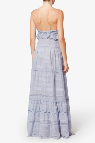 back profile model wearing  Paule Cami Maxi Dress Light Blue Long organic cotton and floral lace dress
Low-cut V-neckline
Thin adjustable straps
Buttoned front
Frills with a crochet finish and pintucks
Lined
Flared cut
100% cotton