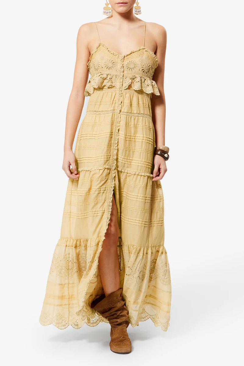 front profile model wearing Paule Cami Maxi Dress Light Ocher Long cotton and floral lace dress
Low-cut V-neckline
Thin adjustable straps
Buttoned front
Frills with a crochet finish and pintucks
Lined
Flared cut
100% cotton