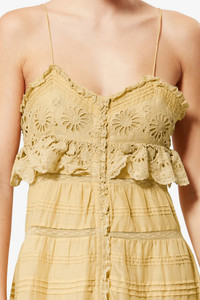 close up detail of Paule Cami Maxi Dress Light Ocher Long cotton and floral lace dress
Low-cut V-neckline
Thin adjustable straps
Buttoned front
Frills with a crochet finish and pintucks
Lined
Flared cut
100% cotton