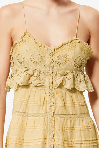 close up detail of Paule Cami Maxi Dress Light Ocher Long cotton and floral lace dress
Low-cut V-neckline
Thin adjustable straps
Buttoned front
Frills with a crochet finish and pintucks
Lined
Flared cut
100% cotton