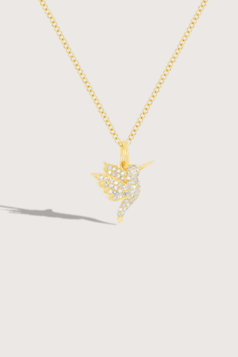 flat lay Pave Diamond Mini Hummingbird Necklace 14k gold